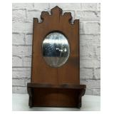 Wood shelf with oval mirror