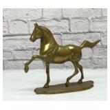 Brass running horse