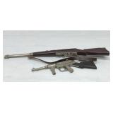 2. Toy cap guns, military rifle, and machine gun
