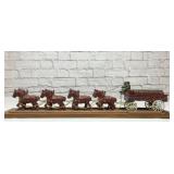 Cast iron 8 horse team pulling beer wagon
