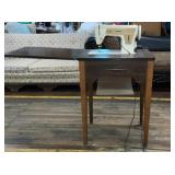 VTG singer sewing machine in cabinet