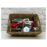 Basket full of assorted kitchen utensils