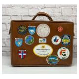 Hartman leather suitcase with travel stickers