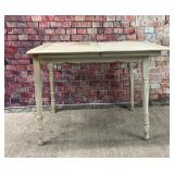 Farmhouse table with painted design on top