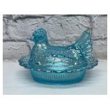 MOSSER George blue carnival hen on a nest