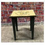 Small table with goldfinch