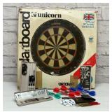 Unicorn dartboard with darts