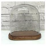 Glass cloche with wood base, wavey glass