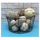 Decorative balls in a wire egg basket