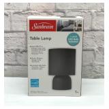 Sunbeam table lamp in box.