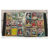 Binder full of baseball cards Braves Orioles Twins