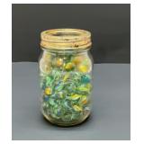 Pint mason jar, full of marbles