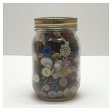 Mason jar with old buttons