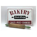Metal bakery sign with vintage rolling pin