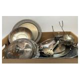 Box full of assorted silver plate serving pieces