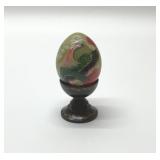 Vintage handpainted jade egg on black wooden stand