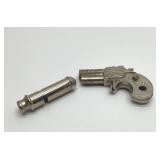 Vintage Derringer, cap gun and whistle