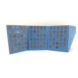 Book with Lincoln head pennies and one Indian head