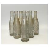 7 VTG 10-2-4 CLEAR GLASS DR PEPPER BOTTLES