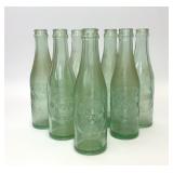7 VTG 10-2-4 GREEN GLASS DR PEPPER BOTTLES