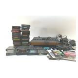 VINTAGE ATARI CONSOLE WITH GAMES AND CONTROLLERS