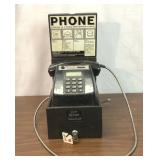 Vintage hotel lobby payphone with key
