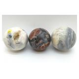 3 CRYSTAL QUARTZ SPHERES WITH GEODE