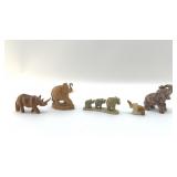 SIX CARVED ELEPHANTS AND RHINO