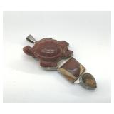VINTAGE CHARLES ALBERT STERLING CARVED PENDANT
