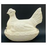 LG HEN ON A NEST WITH CHICKS