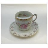 ANTIQUE MUSTACHE CUP AND SAUCER