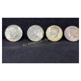 Four 40% silver Kennedy half dollars, various