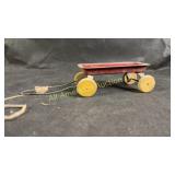 Vintage tin with wooden wheels toy wagon, 4.5"