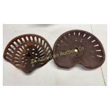Two old steel seats, 1 cast iron, 1 stamped steel
