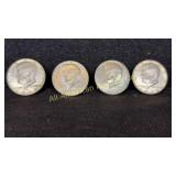 Four 40% silver Kennedy half dollars, various