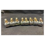 Eight brass 'Bow' napkin rings