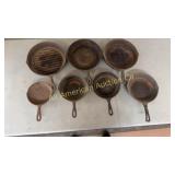 7 vintage cast iron frying pans, from 6 5/8' to