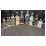 Nine vintage glass bottles