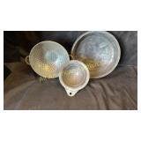 Three vintage copper colanders, 7', 9' & 12'