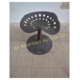 ANTIQUE TRACTOR SEAT ON METAL STAND