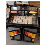 Rowe jukebox with Records & manual , powers