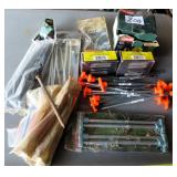 8 penny nails, tent stakes, inflator. no ship