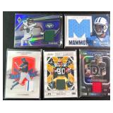 Five (5) Game Used Materials Relic Cards.