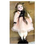 Porcelain Doll on Stand (she soiled her dress)