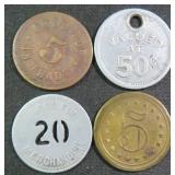 Four (4) Vintage Store Tokens