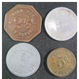 Four (4) Vintage Store Tokens