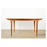 Teak dining table with a hidden foldout leaf