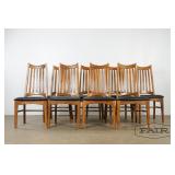 Set of 8 oak dining chairs with black vinyl seats
