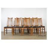 Set of 8 oak dining chairs with black vinyl seats