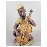 Figurine Of A Monkey Playing A Bass Cello